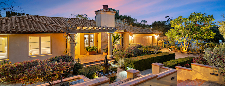 Twilight photo of Spanish style Montecito home for sale on 740 Santecito.